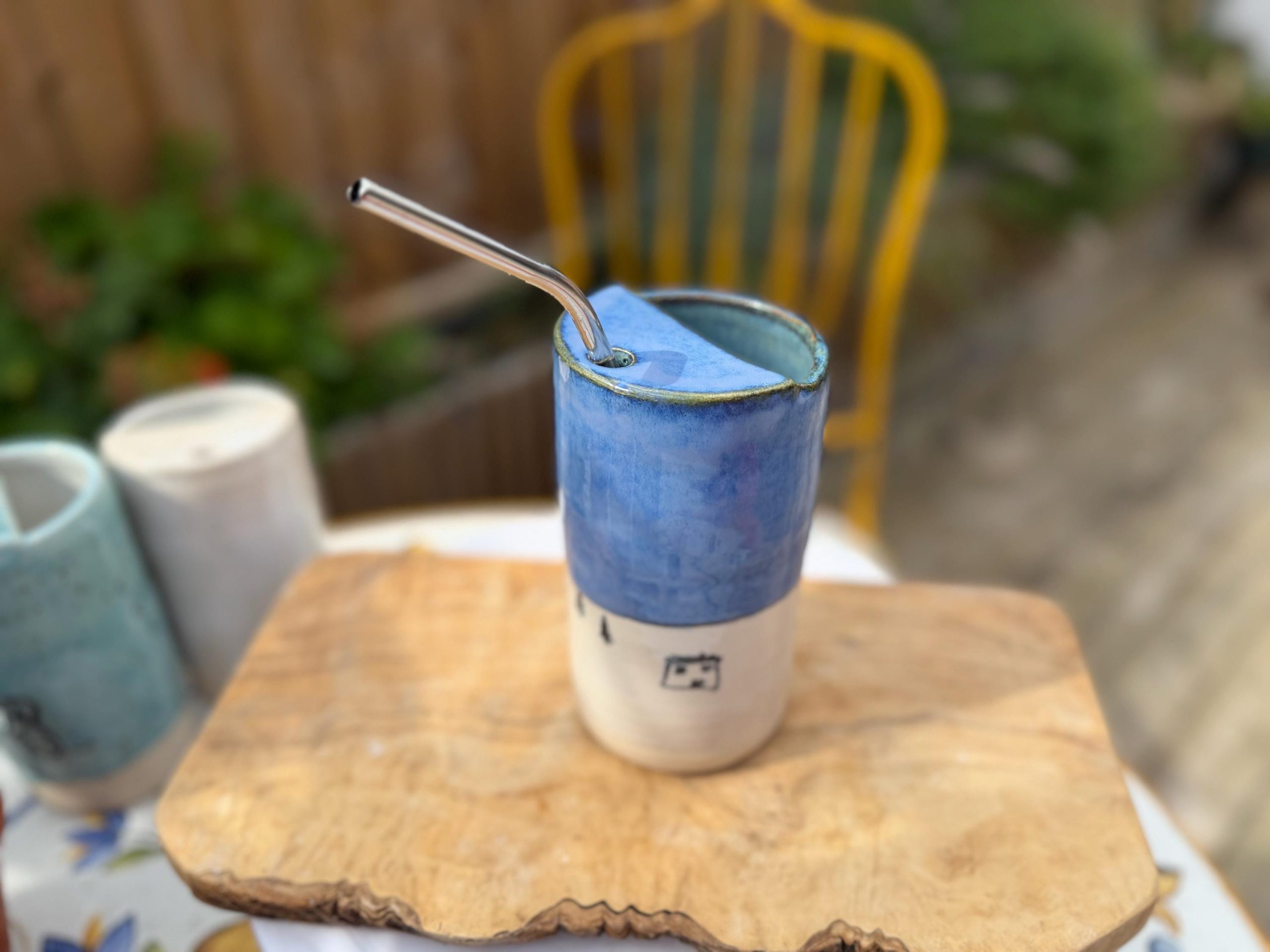 Handmade Blue Ceramic Travel Mug with House Motif & Metal Straw - Image 3